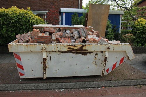 Construction site with waste materials ready for clearance in Crouch End